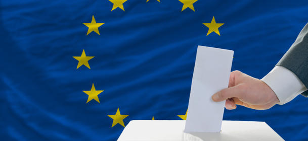 Man Voting On Elections In Europe In Front Of Flag